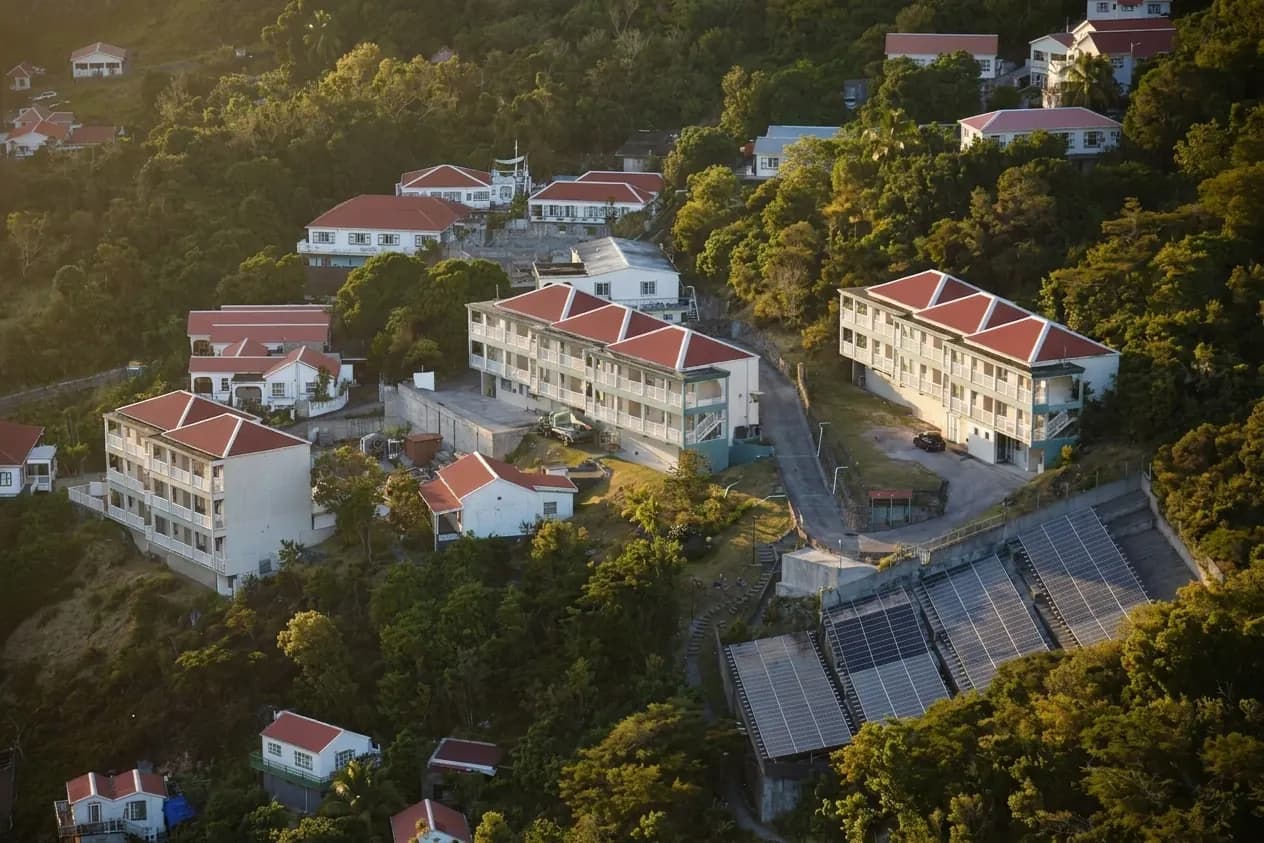 The Hillside buildings from the air, red roofs among the trees